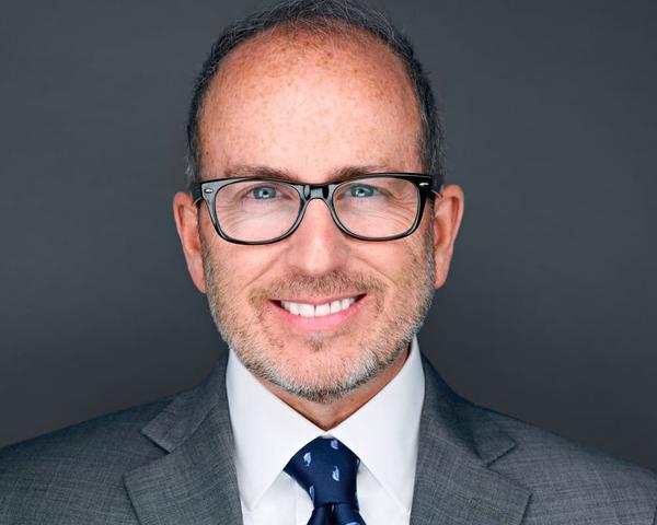 Executive headshot transformation result by NWA Headshots - Bentonville professional photography